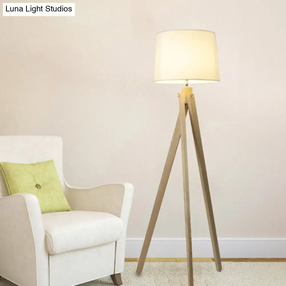 Minimalist Beige Tri-Leg Floor Lamp With Tapered Drum Shade - 1-Light Standing Light Fixture