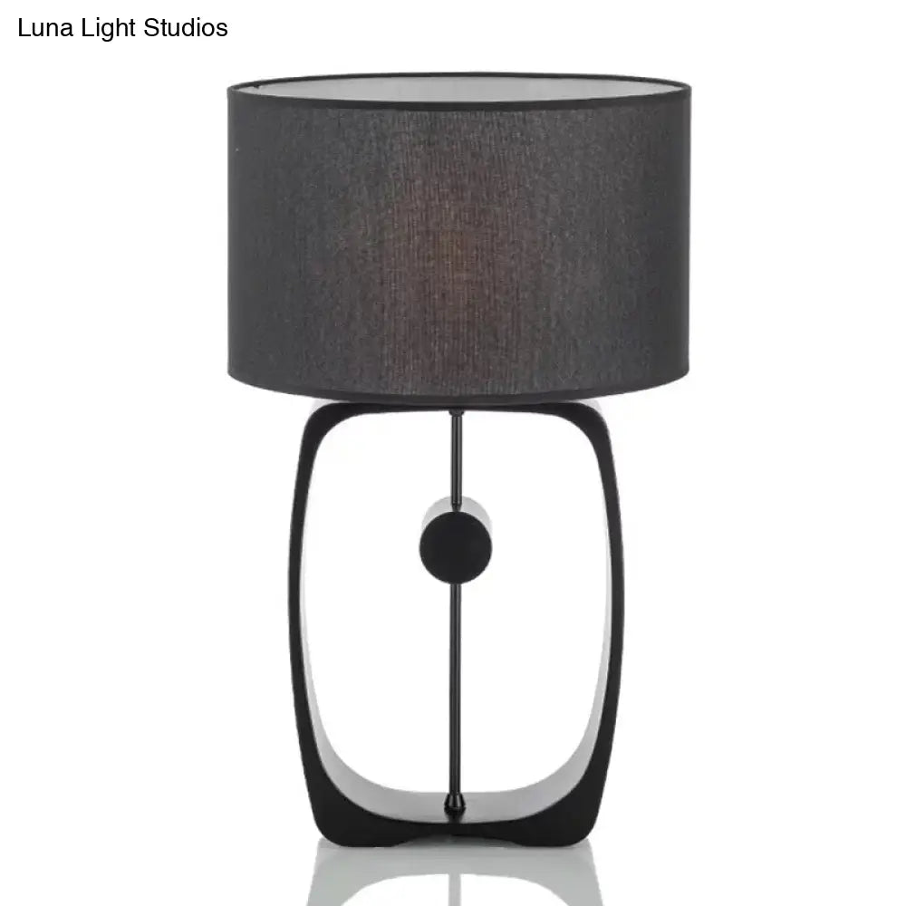 Minimalist Black Fabric Table Lamp With Round Shape And Open Base