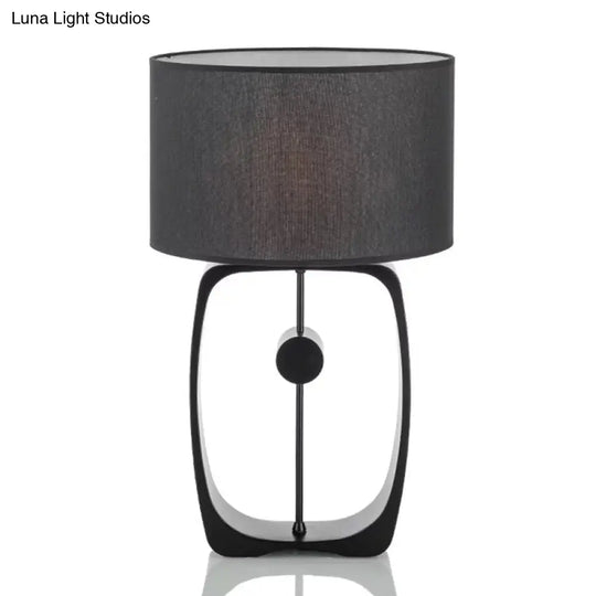 Minimalist Black Fabric Table Lamp With Round Shape And Open Base