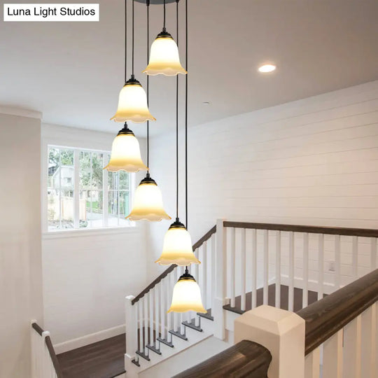 Minimalist Black Flower Stairs Pendant Light With Frosted Glass And Round Canopy