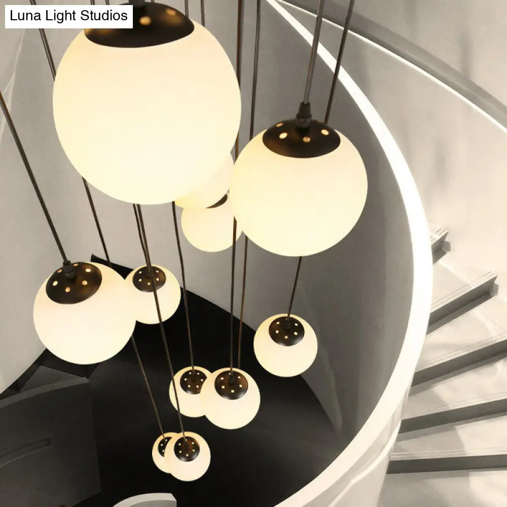 Minimalist Black Globe Pendant Light With Cream Glass - Ideal For Stairways