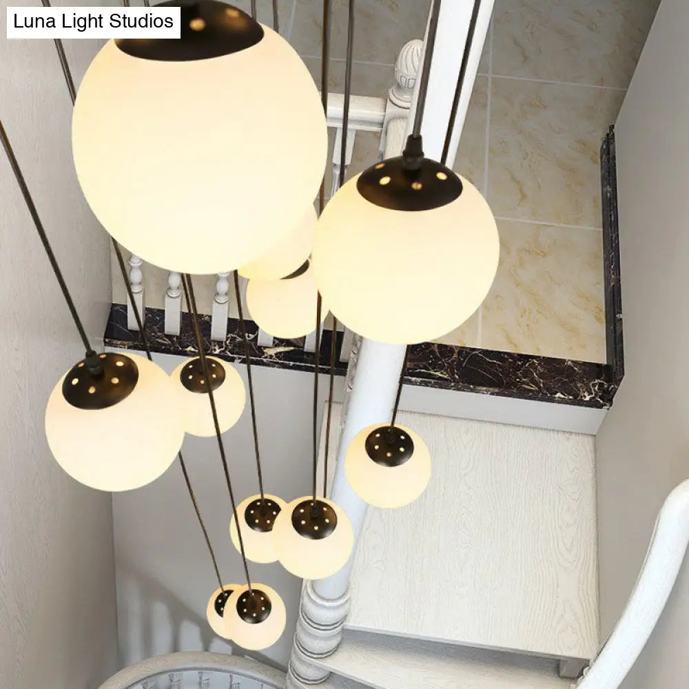 Minimalist Black Globe Pendant Light With Cream Glass - Ideal For Stairways