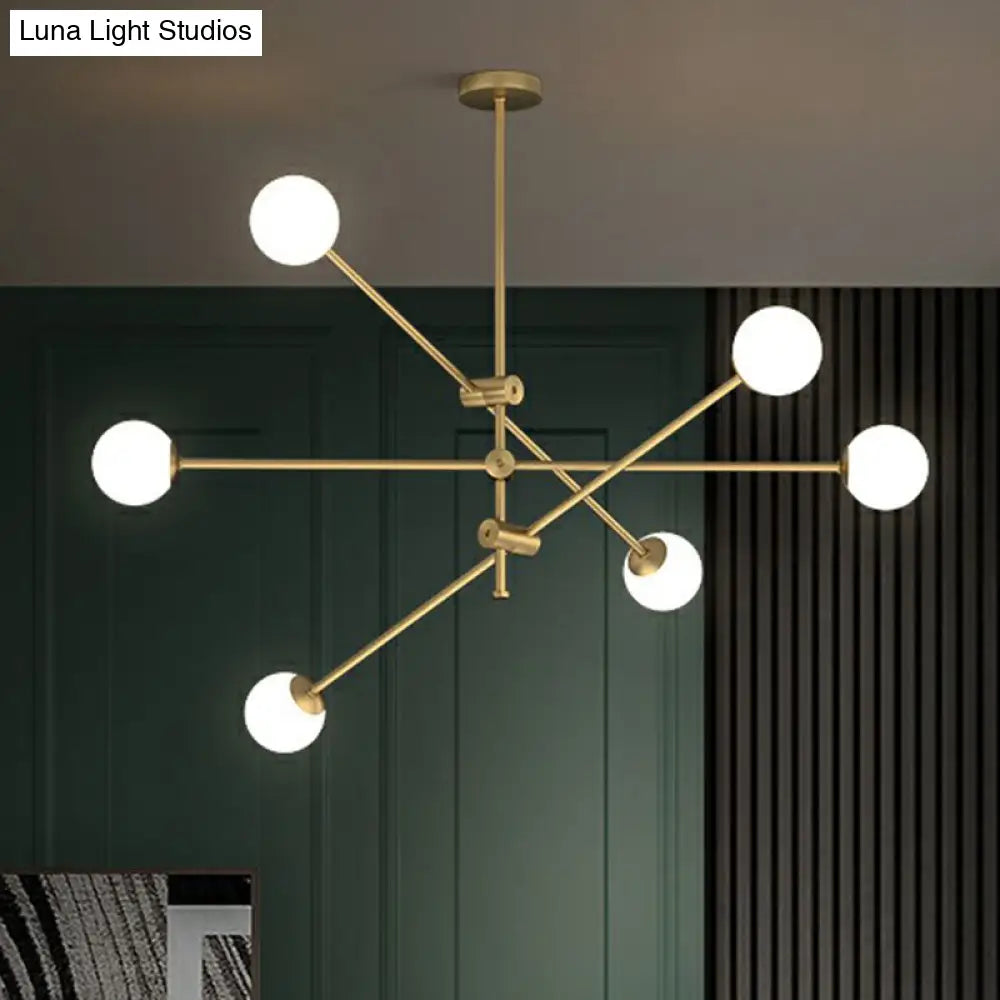 Minimalist Brass Finish Chandelier With Swivel Arm And Glass Shade