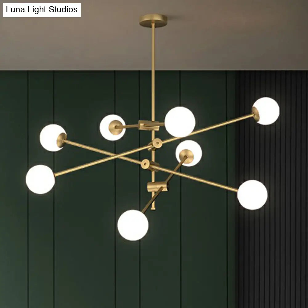 Minimalist Brass Finish Chandelier With Swivel Arm And Glass Shade