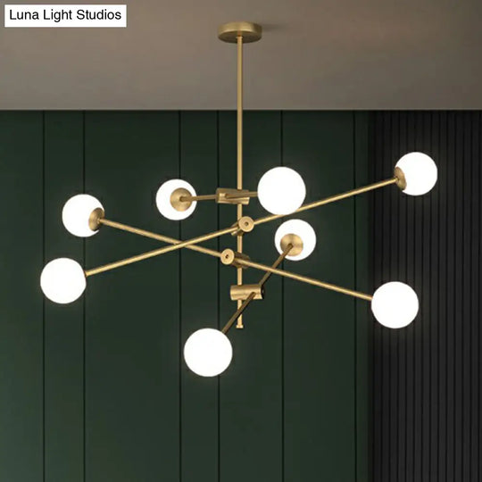 Minimalist Brass Finish Chandelier With Swivel Arm And Glass Shade