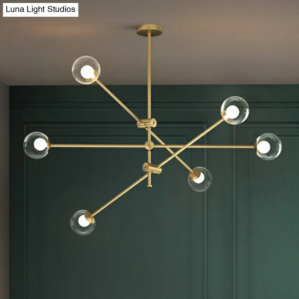 Minimalist Brass Finish Chandelier With Swivel Arm And Glass Shade