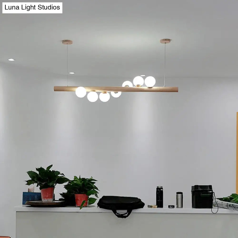 Minimalist Cream Glass Led Pendant Light For Restaurants - Ball Island Ceiling With Wood Accent