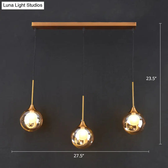 Minimalist Glass Pendant Light With 3-Head Design For Dining Room And Multiple Hanging Options Amber