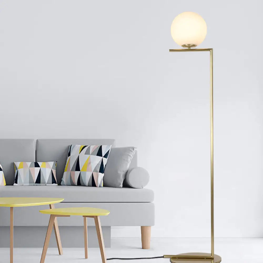 Minimalist Gold Orb Floor Lamp With Frosted Glass Shade And Right Angle Stand