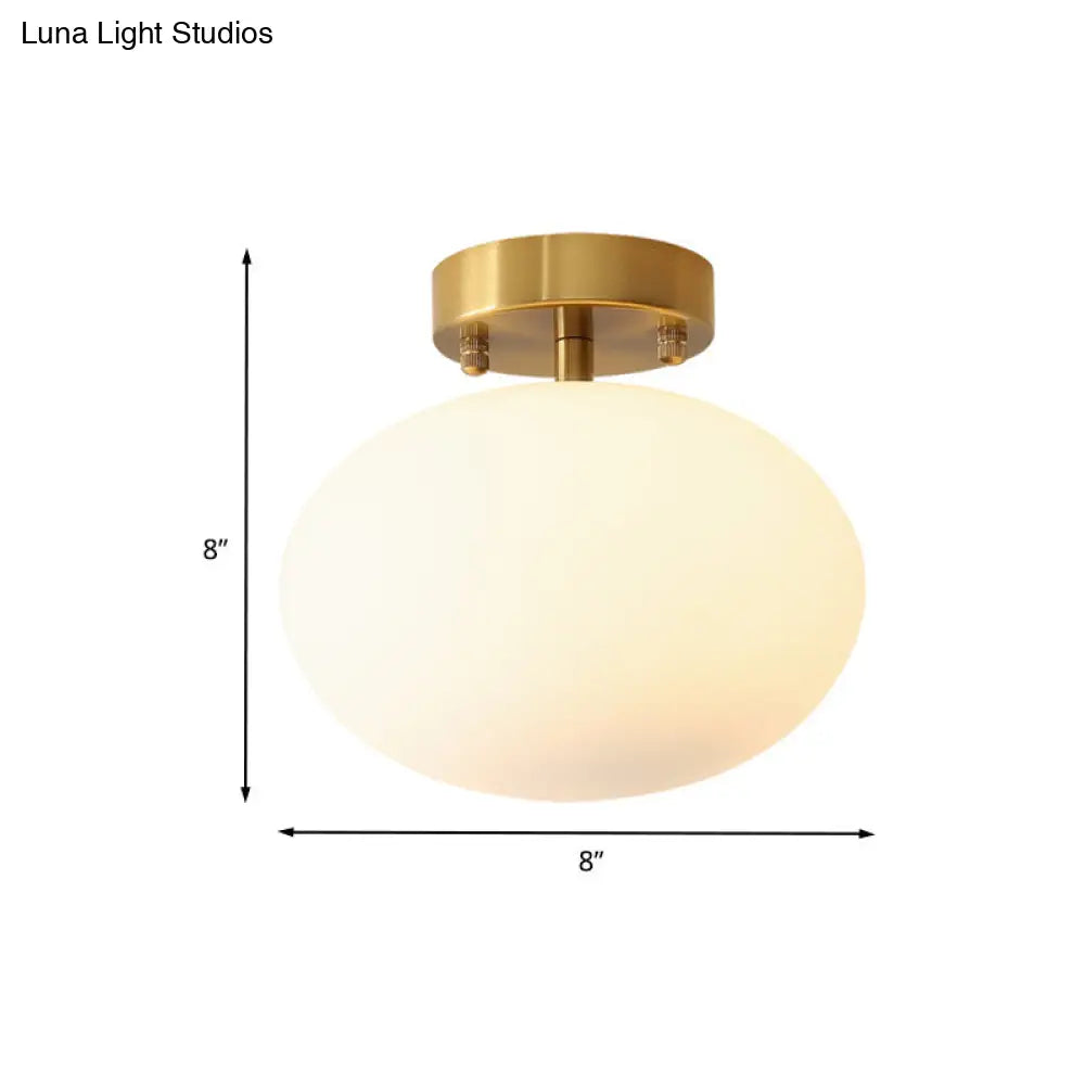 Sleek Gold Oval Semi Flush Light Fixture - Minimalist 1-Light Cream Glass Ceiling Lamp For Bedroom