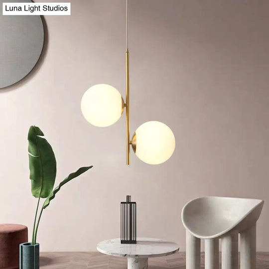 Modern Gold Suspended Light Fixture With Opaque Glass Spheres - Ideal For Dining Room Décor