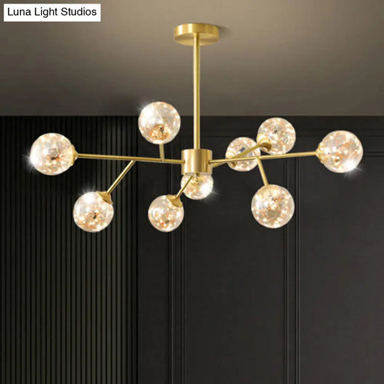 Minimalist Metal Led Chandelier In Gold With Starburst Pendulum Design And Bubble Shade