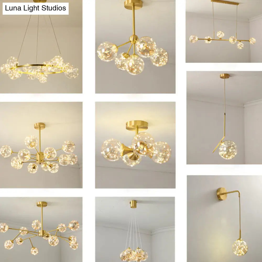 Minimalist Metal Led Chandelier In Gold With Starburst Pendulum Design And Bubble Shade