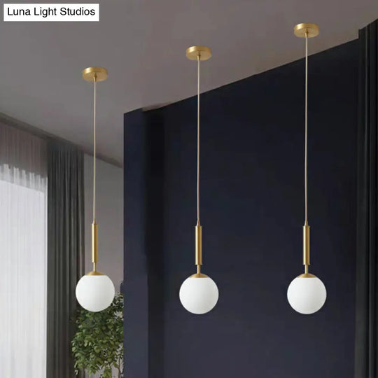 Minimalist Milk Glass Ball Pendant Light In Brass - 1-Light Hanging Lamp For Dining Room