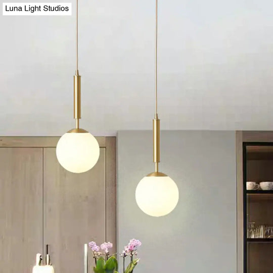 Milk Glass Ball Pendant Light With Brass Finish - Minimalist 1-Light Dining Room Fixture