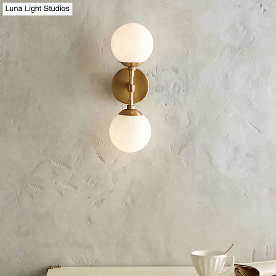 Minimalist Milky Glass 2-Light Wall Sconce - Brass Finish