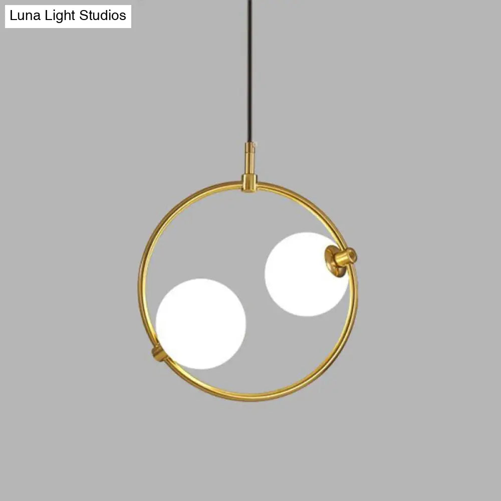 Minimalist Milky Glass Orb Pendant Light With Gold Pendulum And Metal Frame
