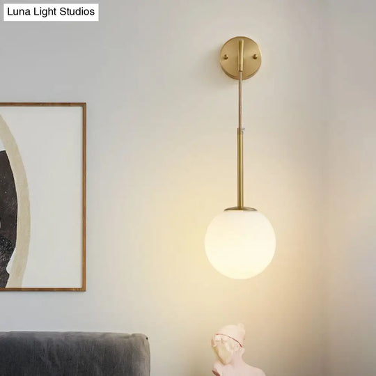 Minimalist Mini Globe Wall Sconce With Cream Glass And Gold Finish For 1-Bulb Lighting