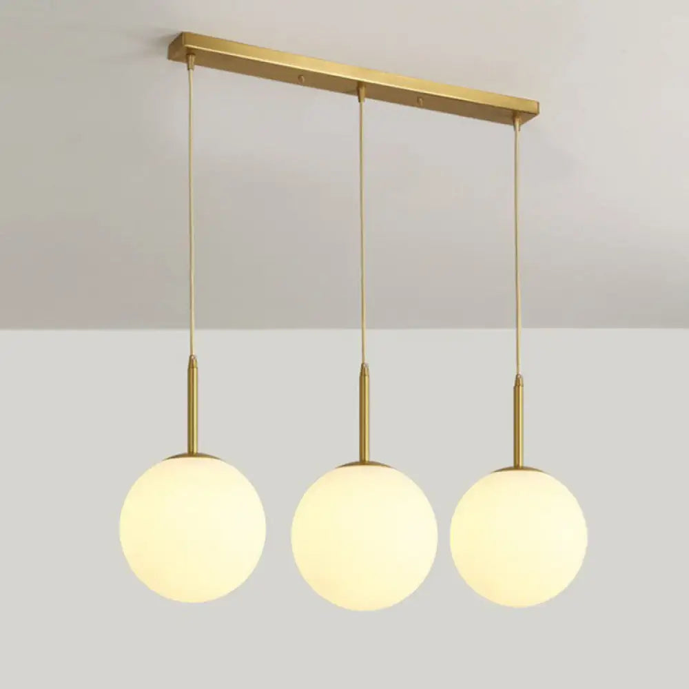 Minimalist Opal Glass Sphere Pendant Light With 3-Bulb Gold Pendulum Design - Ideal For Dining Room