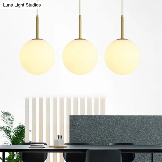 Minimalistic 3-Bulb Gold Pendant Light For Dining Room - Opal Glass Sphere Design