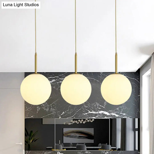 Minimalistic 3-Bulb Gold Pendant Light For Dining Room - Opal Glass Sphere Design