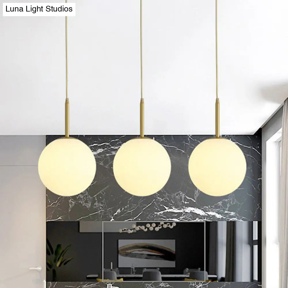 Minimalist Opal Glass Sphere Pendant Light With 3-Bulb Gold Pendulum Design - Ideal For Dining Room