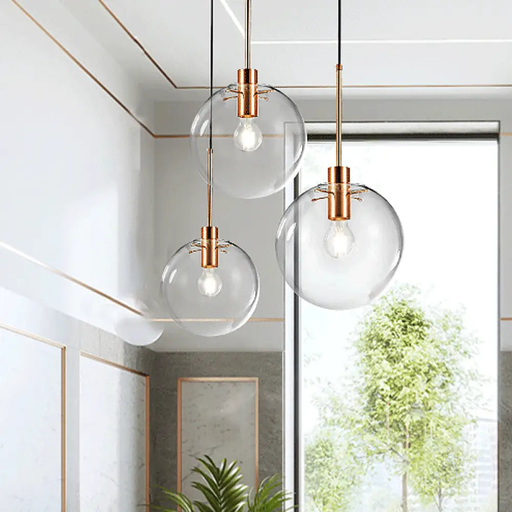 Minimalist Rose Gold Cluster Pendant With Clear Glass For Ceiling - 3-Bulb Fixture