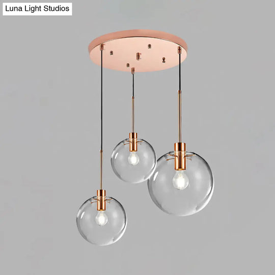 Minimalist Rose Gold Cluster Pendant With Clear Glass For Ceiling - 3-Bulb Fixture