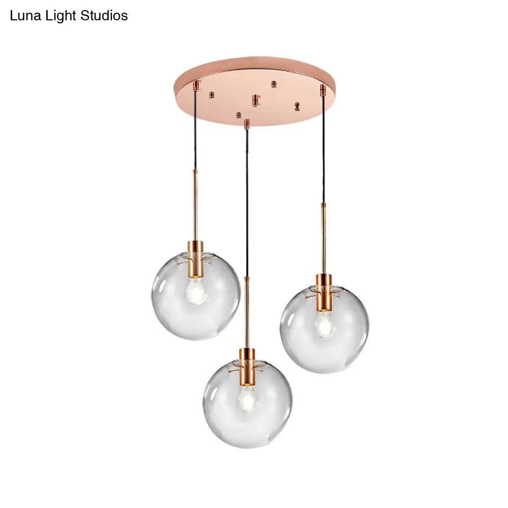 Minimalist Rose Gold Cluster Pendant With Clear Glass For Ceiling - 3-Bulb Fixture