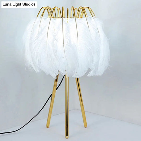 Minimalistic Metallic Tripod Table Light With Feather Shade In Gold