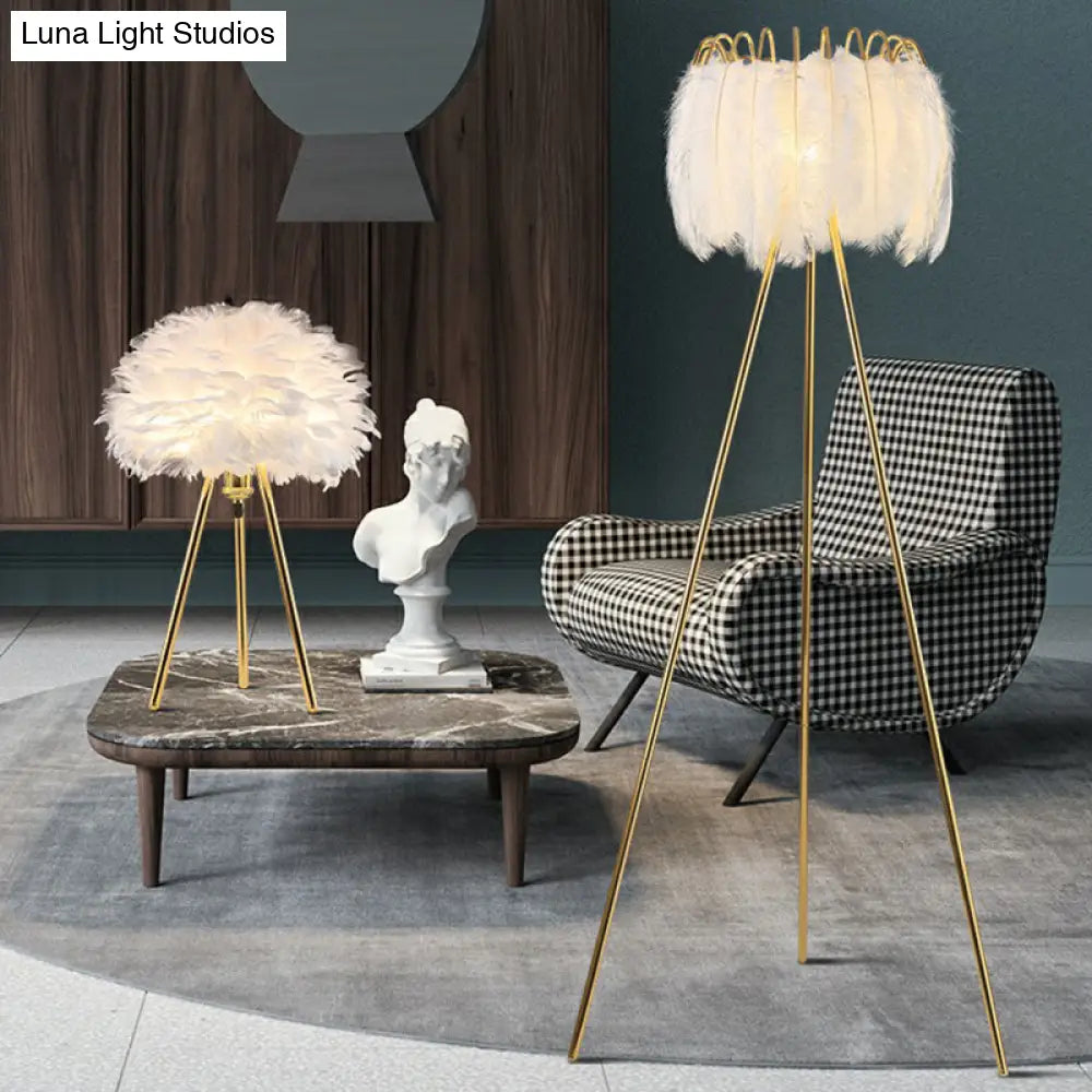 Minimalistic Metallic Tripod Table Light With Feather Shade In Gold