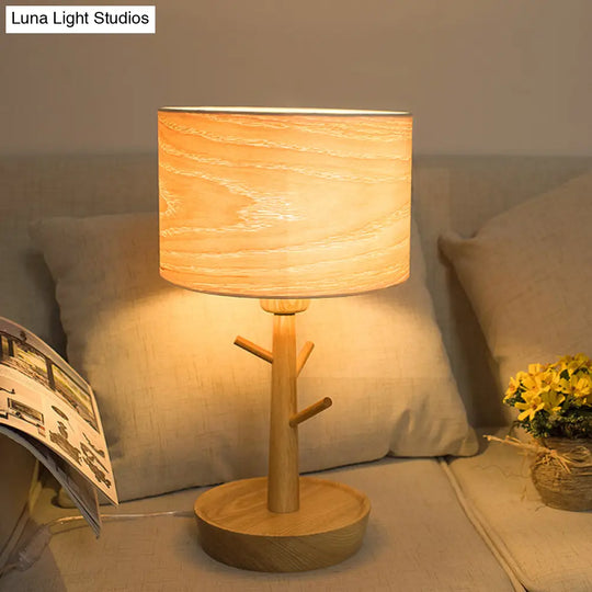 Modern 1-Light Beige Table Lamp With Wood Drum Shade And Hook Design - Functional Night Lighting