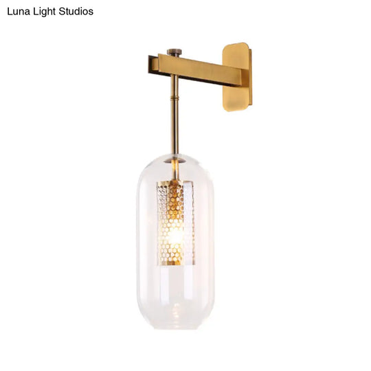 Modern 1-Light Clear Glass Tube Sconce - Brass Bedroom Wall Mount Lamp