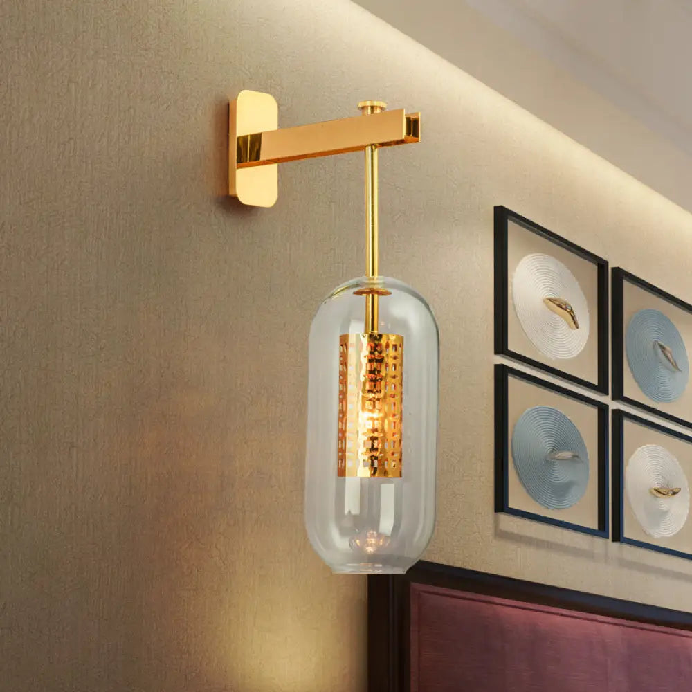 Modern 1-Light Clear Glass Tube Sconce - Brass Bedroom Wall Mount Lamp