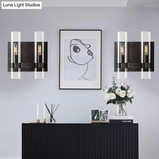 Modern 2-Headed Wall Sconce: Clear Glass Symmetrical Tube Black/Brass Finish