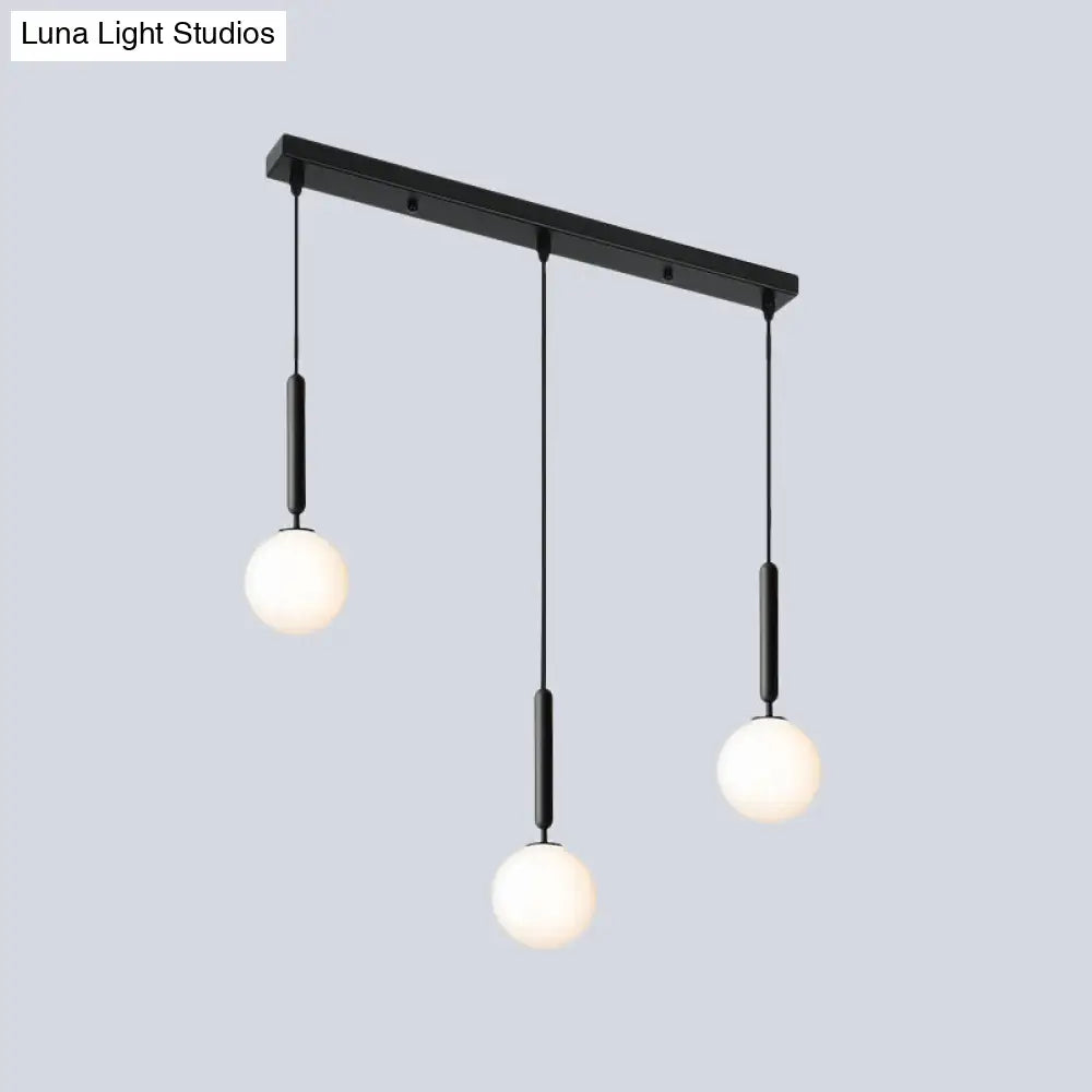 Modern 3-Bulb Black Orb Pendant Light With Cream Glass Shade