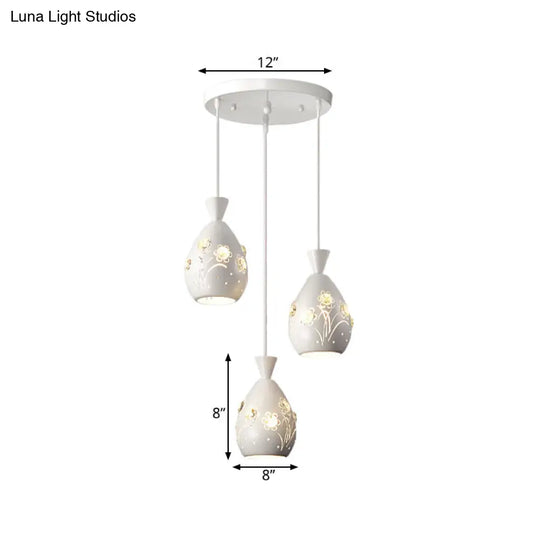 Modern White Wine Can-Shaped Pendant Light With Laser Cut Flower Design - Multi-Head Iron Hanging