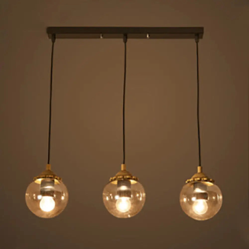 Modern 3-Light Clear Glass Pendant Lamp In Black For Coffee Shops - Orb Design With Linear/Round