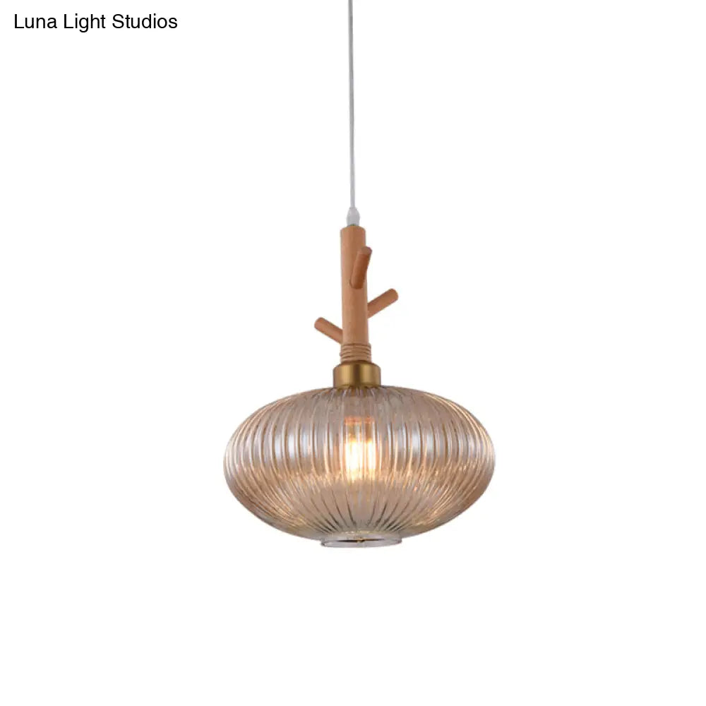 Modern Amber Glass Oval Pendant Lamp With Prismatic Design And Wooden Branch Cap