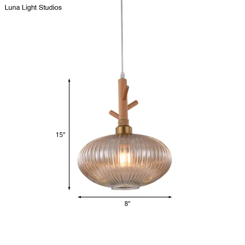 Modern Amber Glass Oval Pendant Lamp With Prismatic Design And Wooden Branch Cap