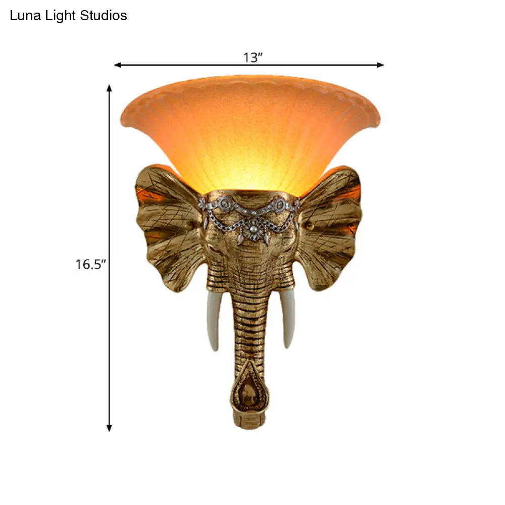 Modern Amber Glass Sconce With Gold Elephant Accent