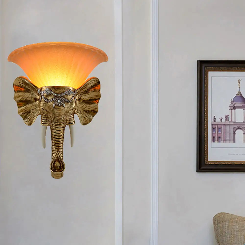 Modern Amber Glass Sconce With Gold Elephant Accent