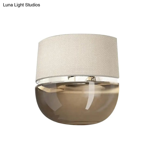 Modern Arched Wall Sconce In White With Grid Pattern Fabric And Tan Glass Bottom