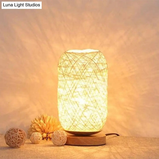 Modern Asian Bamboo Rattan Capsule Night Table Light - 1-Light Beige/Coffee Lamp