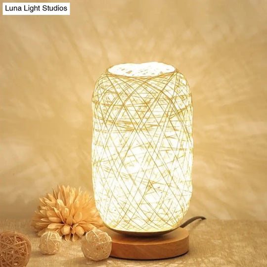 Modern Asian Bamboo Rattan Capsule Night Table Light - 1-Light Beige/Coffee Lamp