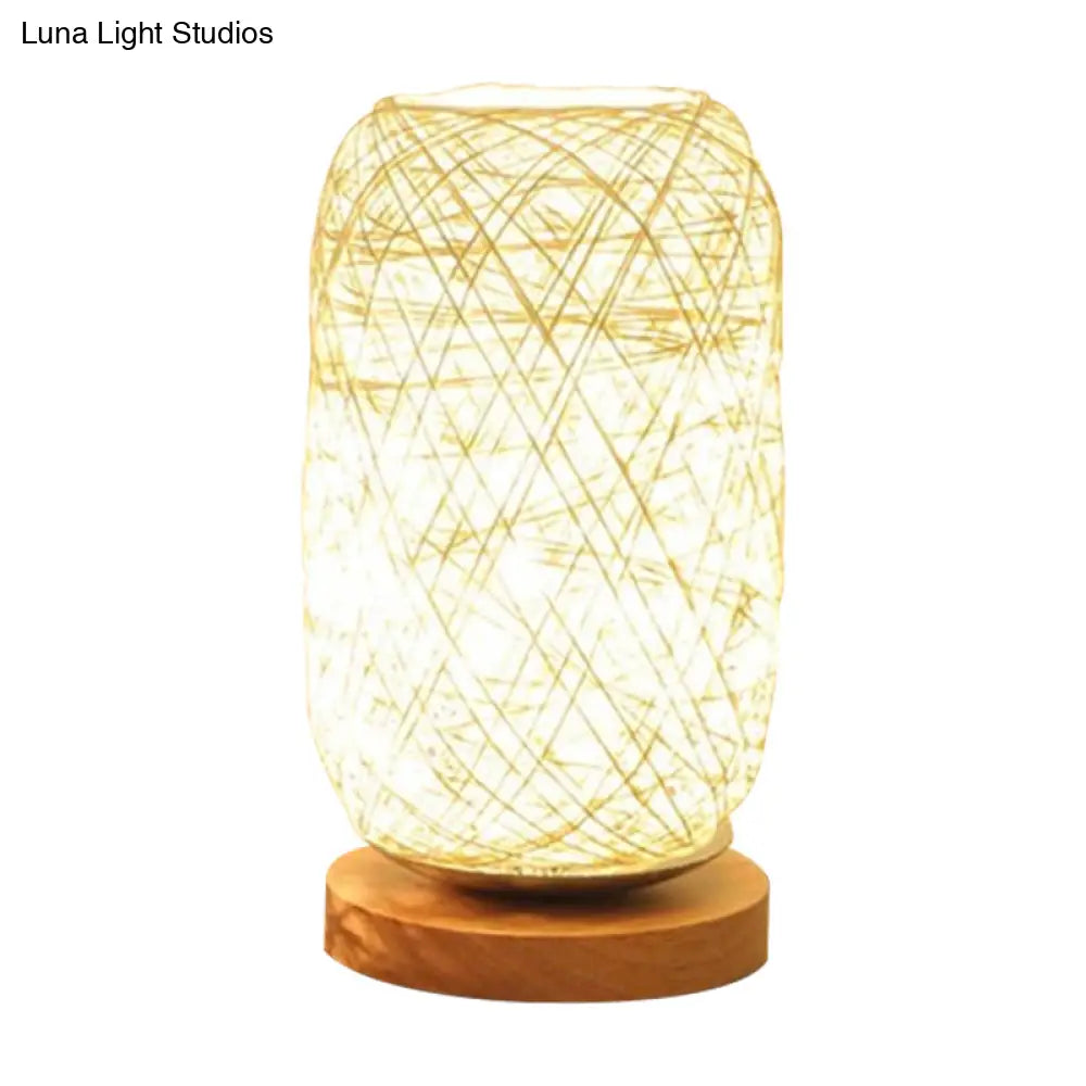 Modern Asian Bamboo Rattan Capsule Night Table Light - 1-Light Beige/Coffee Lamp