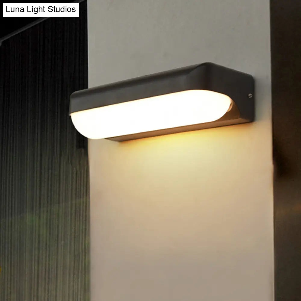 Modern Black Acrylic Wall Sconce With Flush Capsule Design And Half-Bulb Mounting