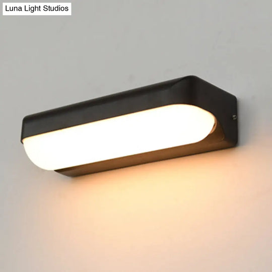 Modern Black Acrylic Wall Sconce With Flush Capsule Design And Half-Bulb Mounting