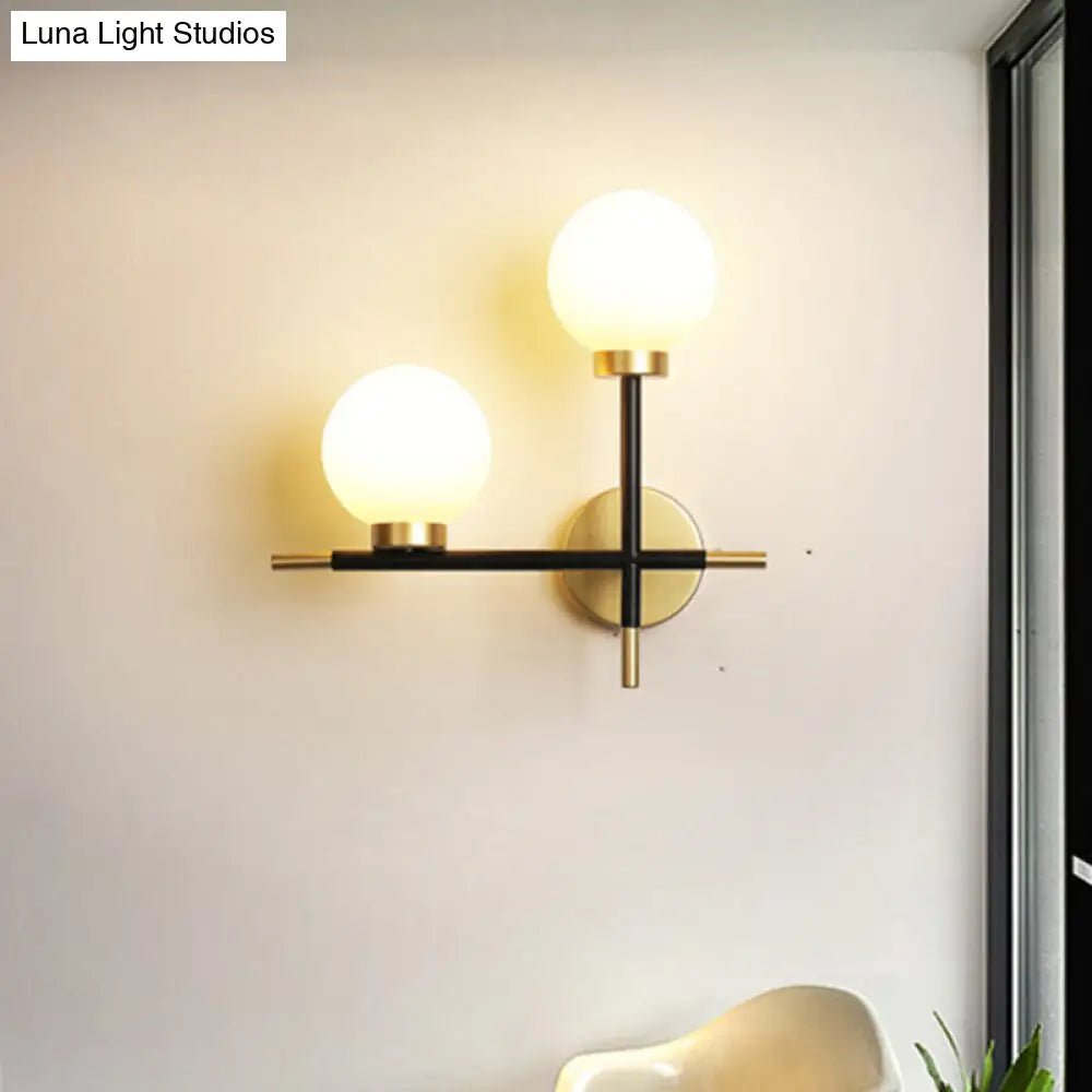 Modern Black Double Globe Wall Lamp With Cross Design - 2-Bulb Milky Glass Sconce Light Fixture For