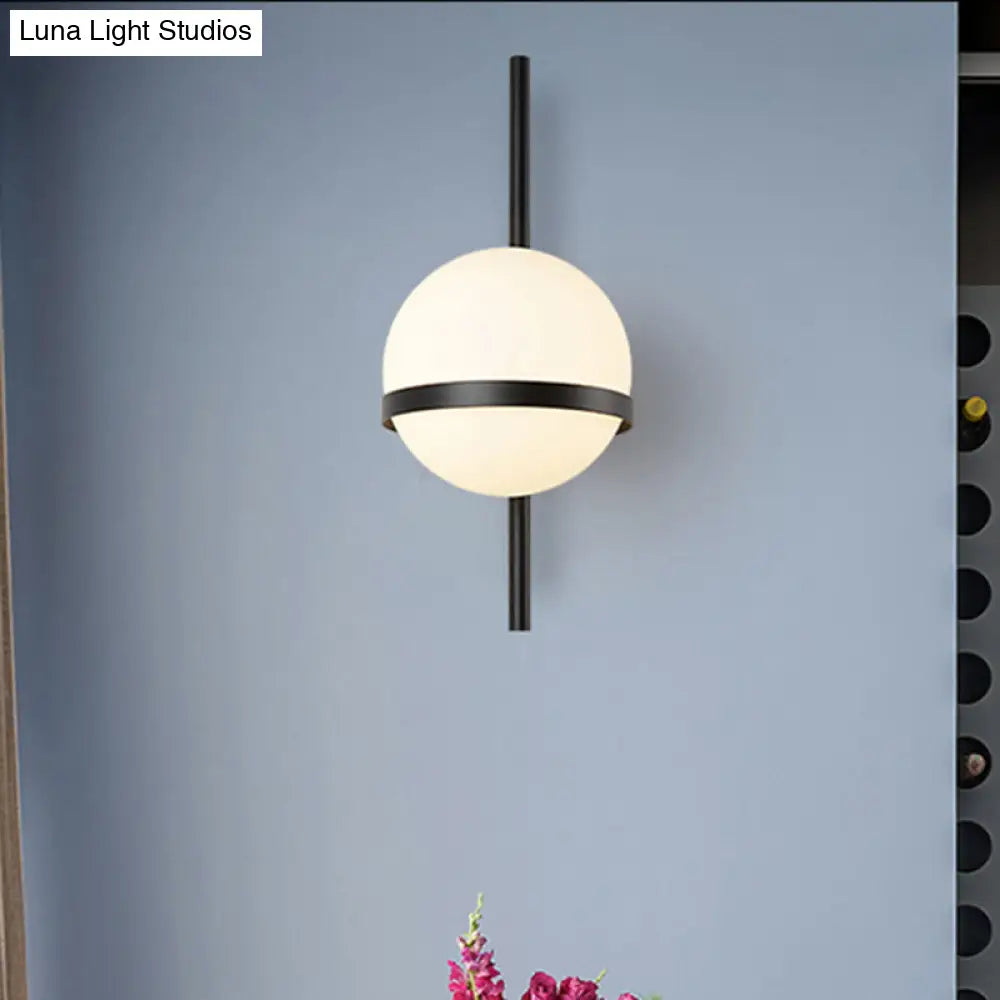 Modern Black/Gold Vertical Wall Sconce With Orbit Opal Glass Shade - 1 Head Metal Lamp 6/8 Width